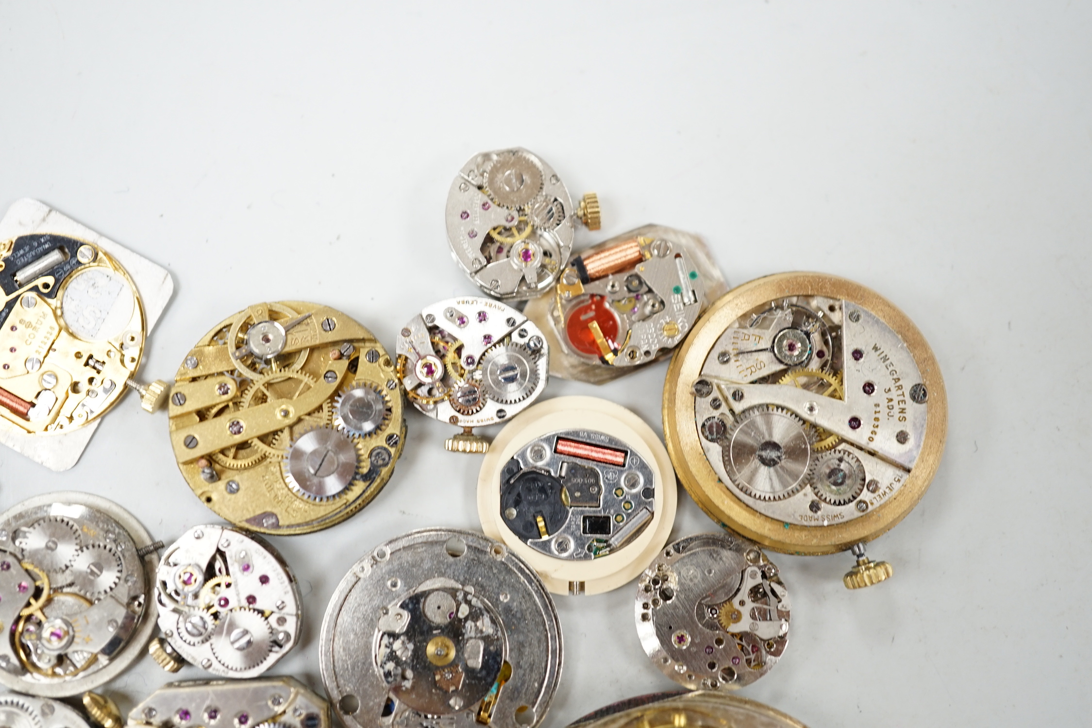 A quantity of assorted wrist and pocket watch parts and movements.